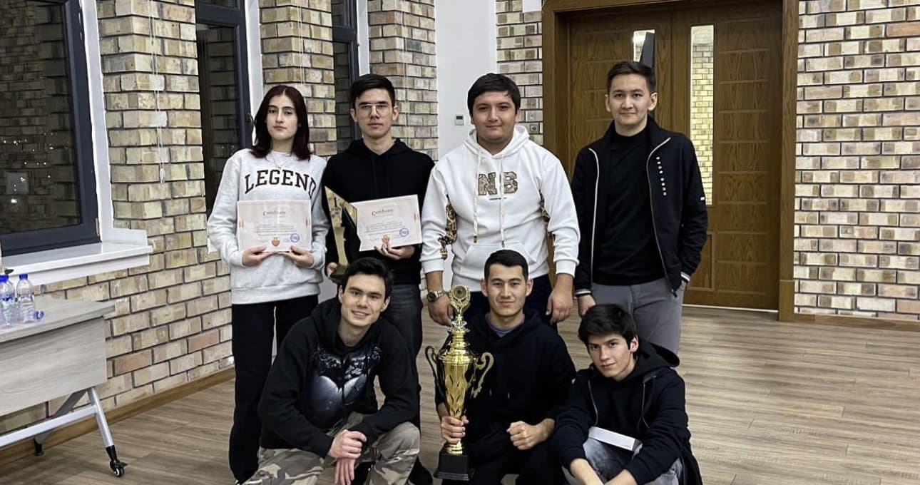 The Webster chess team with their trophy and certificates