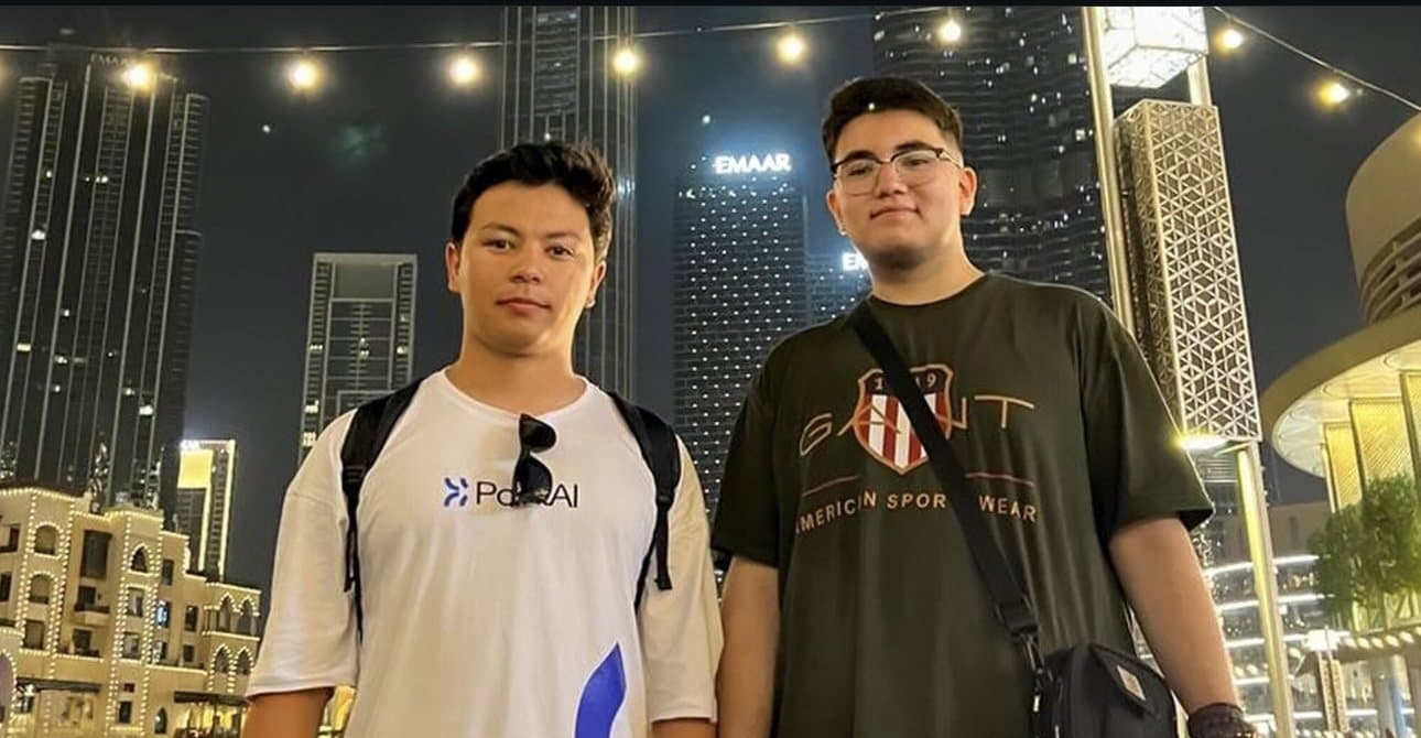 Sulton Mavlonov and a teammate at night in a city