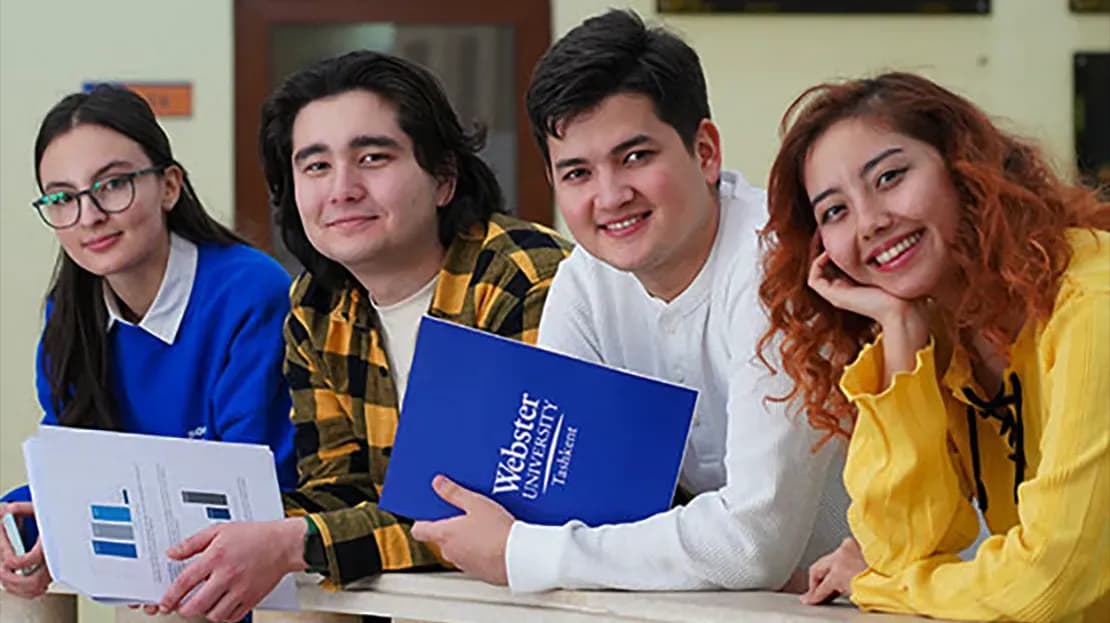 Students standing in a line and smiling